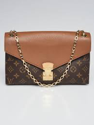 Louis Vuitton Pallas Chain Wallet featuring the signature Monogram canvas combined with brown leather