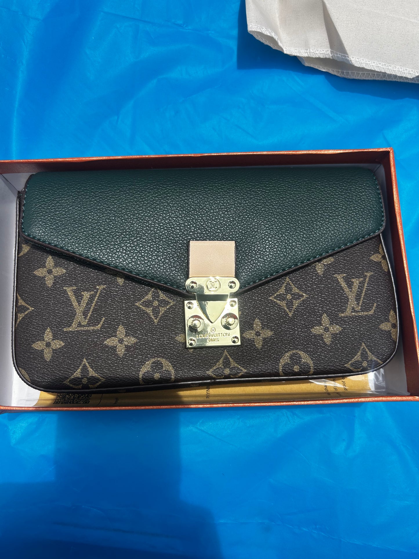 Louis Vuitton Pallas Chain Wallet featuring the classic monogram canvas paired with a green leather flap.