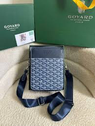 Goyard Jouvence crossbody bag in grey signature chevron pattern.
