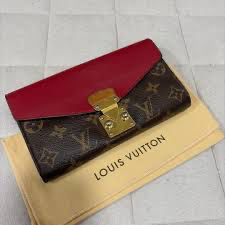 Louis Vuitton Pallas Chain Wallet featuring the classic monogram canvas paired with a red leather flap.