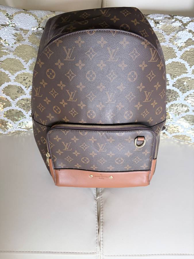 Louis Vuitton Discovery Backpack in Monogram canvas with natural cowhide-leather trim