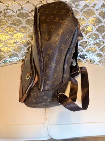 Louis Vuitton Discovery Backpack in Monogram canvas with natural cowhide-leather trim