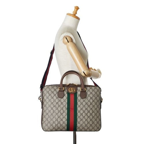 Gucci Ophidia GG briefcase, a vintage-inspired bag crafted from GG Supreme canvas featuring the iconic green and red Web stripe
