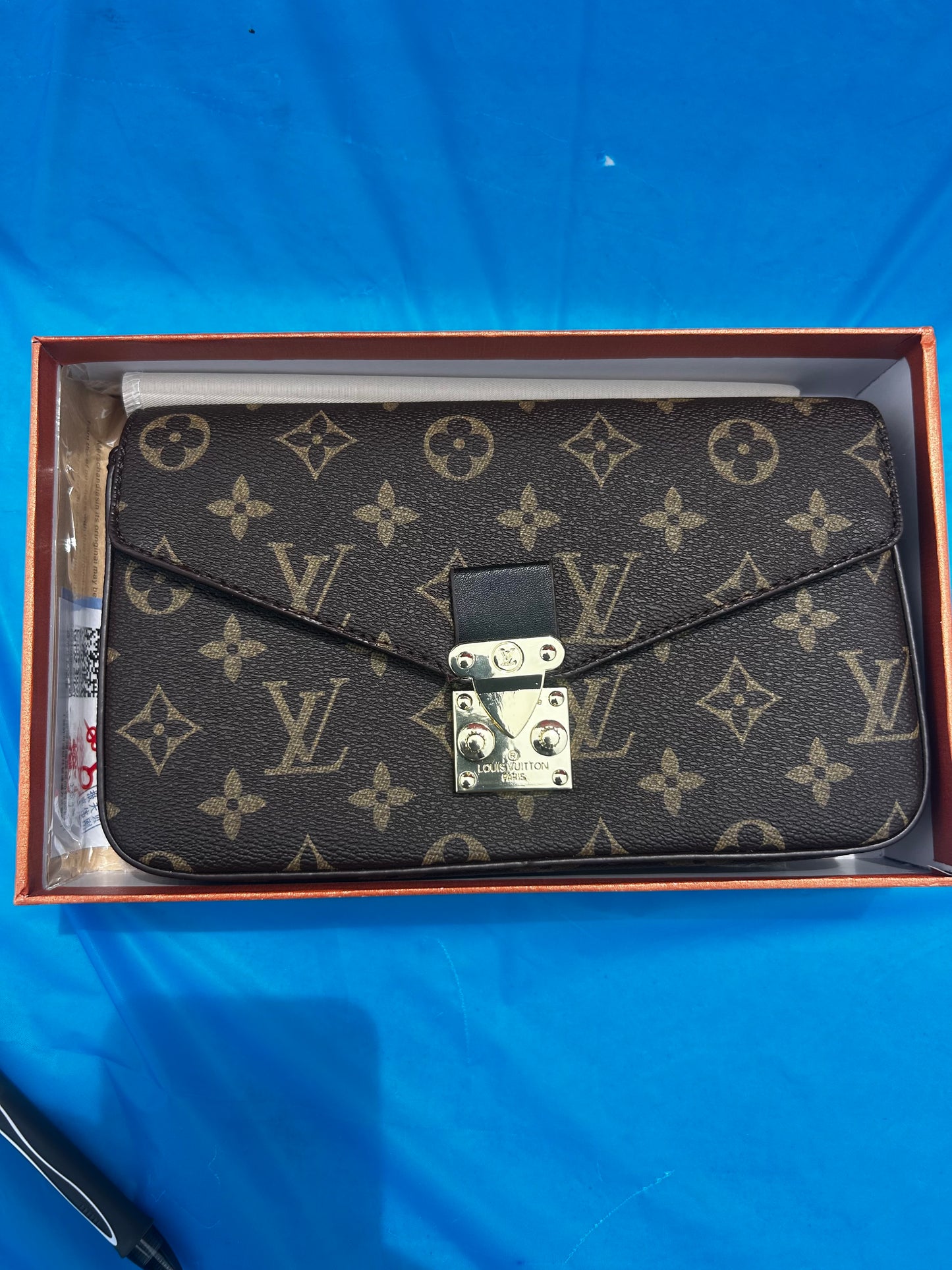 Louis Vuitton Pallas Chain Wallet featuring the classic monogram canvas