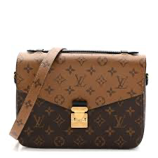 Louis Vuitton Pallas Chain Wallet featuring the signature Monogram Reverse canvas style