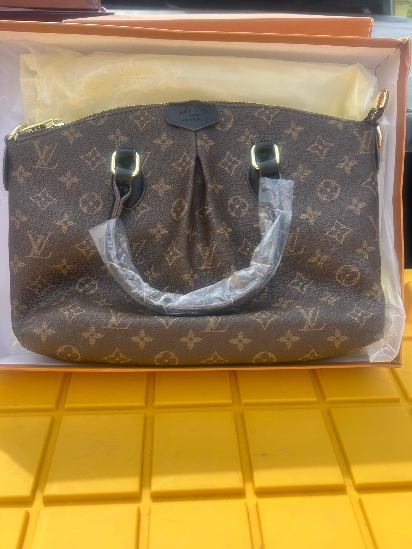 Louis Vuitton Boetie MM NM Monogram bag trimmed in black handles