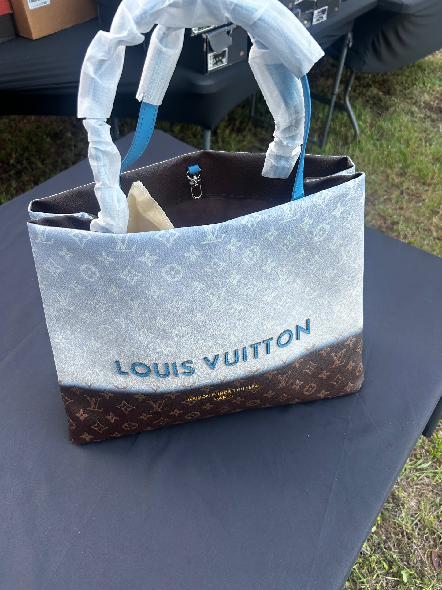 Louis Vuitton "By the Pool" collection OnTheGo tote bag in a blue gradient monogram canvas